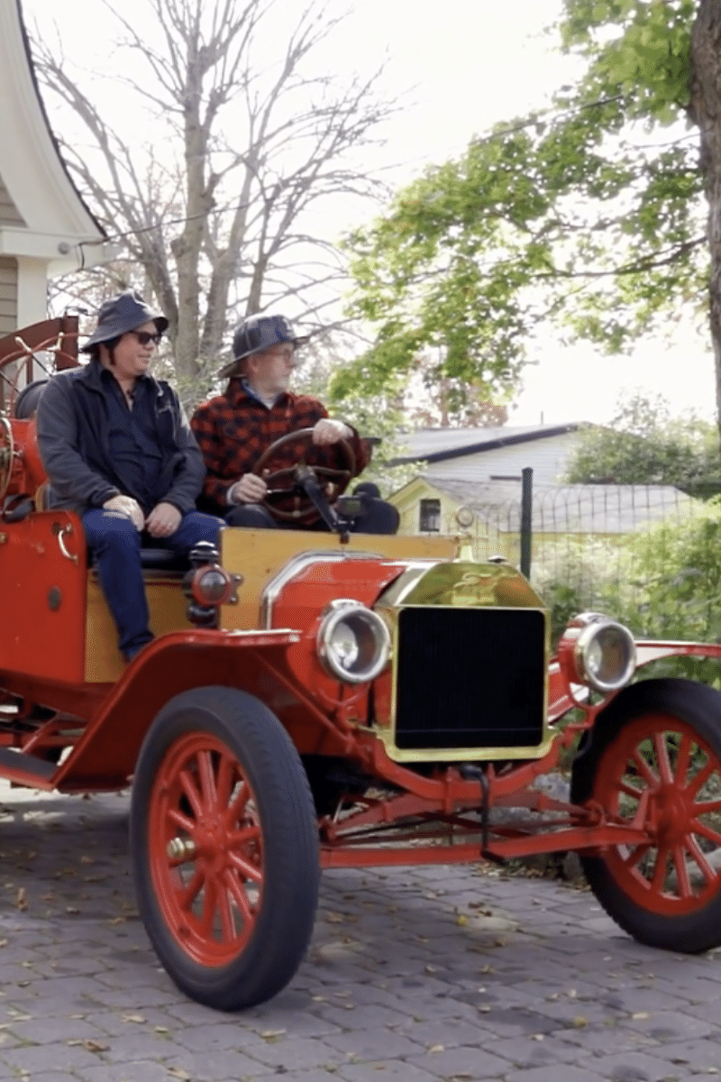 men in antique fire engine in lunenburg